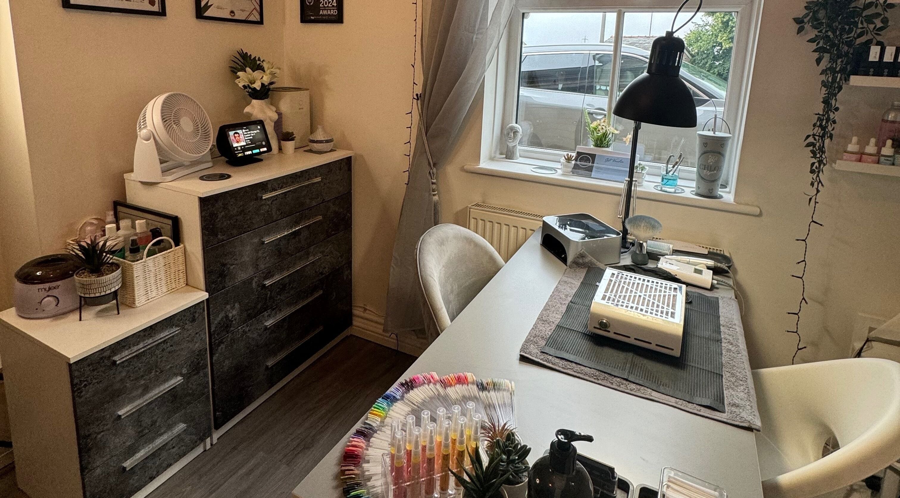 Modern nail station at Chloe Elizabeth - Nails and Beauty, Helsby, England, GB. Cozy decor and professional setup.