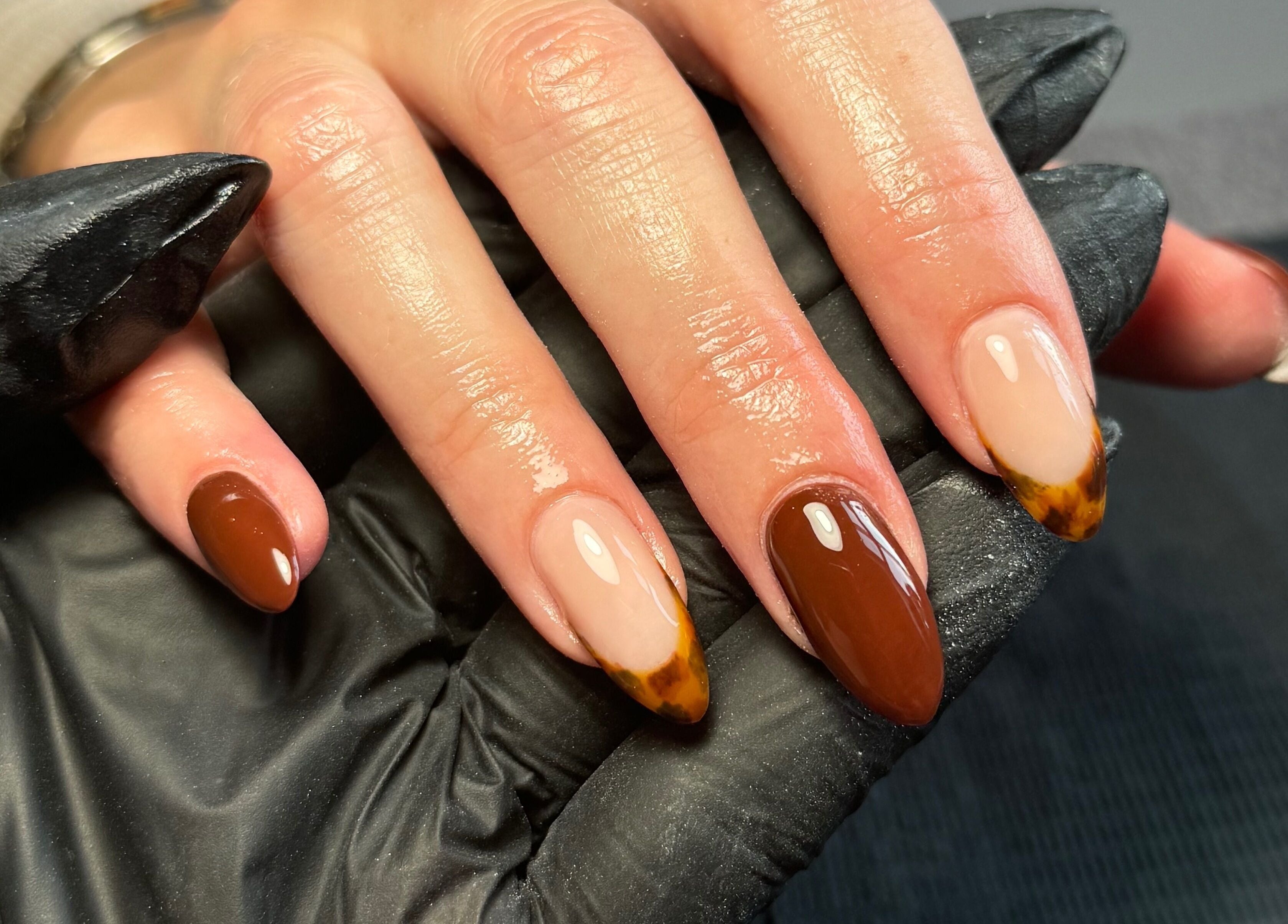 Refined nail art at Chloe Elizabeth - Nails and Beauty, Helsby, England, GB showcasing glossy brown and beige tones.