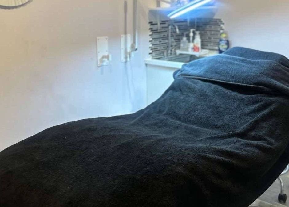 Cozy treatment room in Parlur Cosmetology Salon & Spa, Winnipeg, Manitoba, CA, featuring a plush treatment bed.