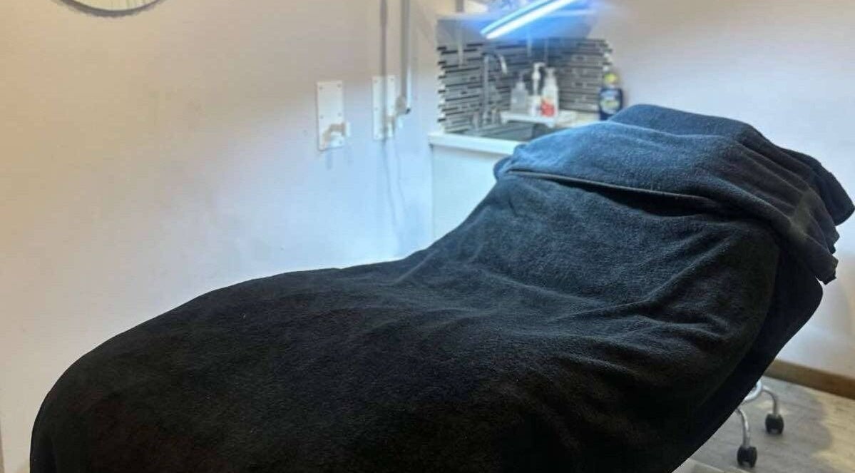 Cozy treatment room in Parlur Cosmetology Salon & Spa, Winnipeg, Manitoba, CA, featuring a plush treatment bed.