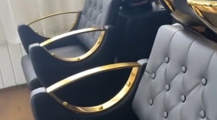 Luxurious seating at Nspyre Beauty in Bridgetown, Christ Church, BB, featuring plush chairs with gold accents.
