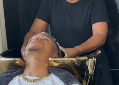 Client enjoys a relaxing hair wash at Nspyre Beauty, Bridgetown, Christ Church, BB.