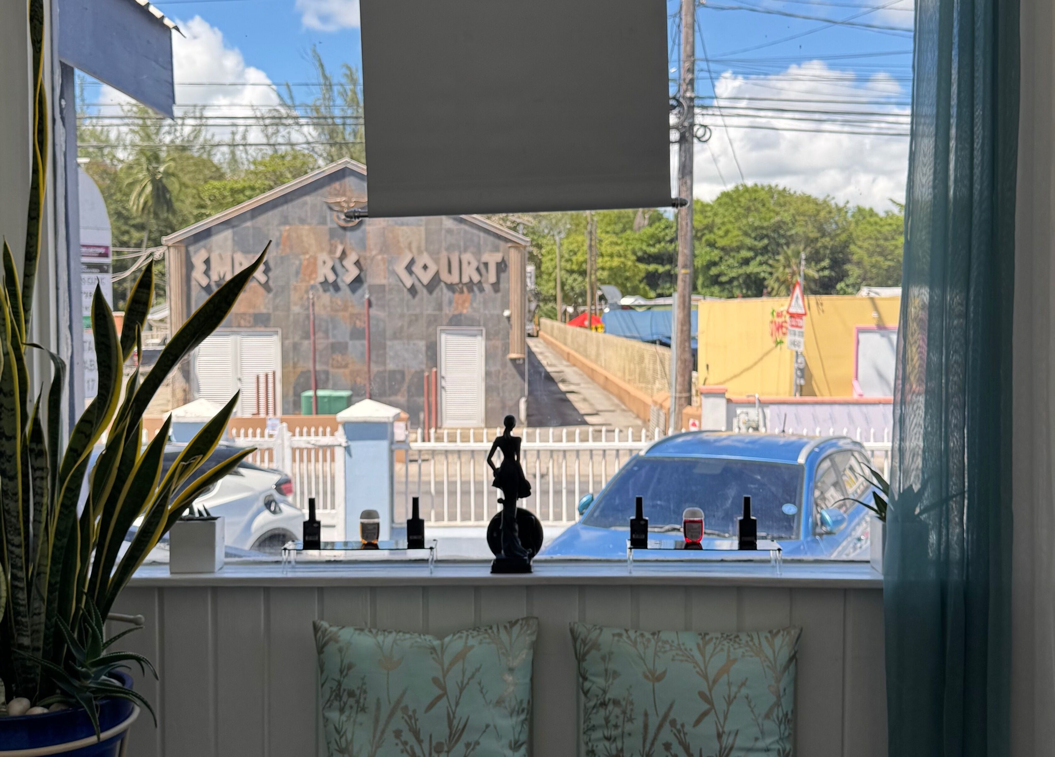 Relaxing view from Nspyre Beauty in Bridgetown, Christ Church, BB with green plants and cozy cushions.