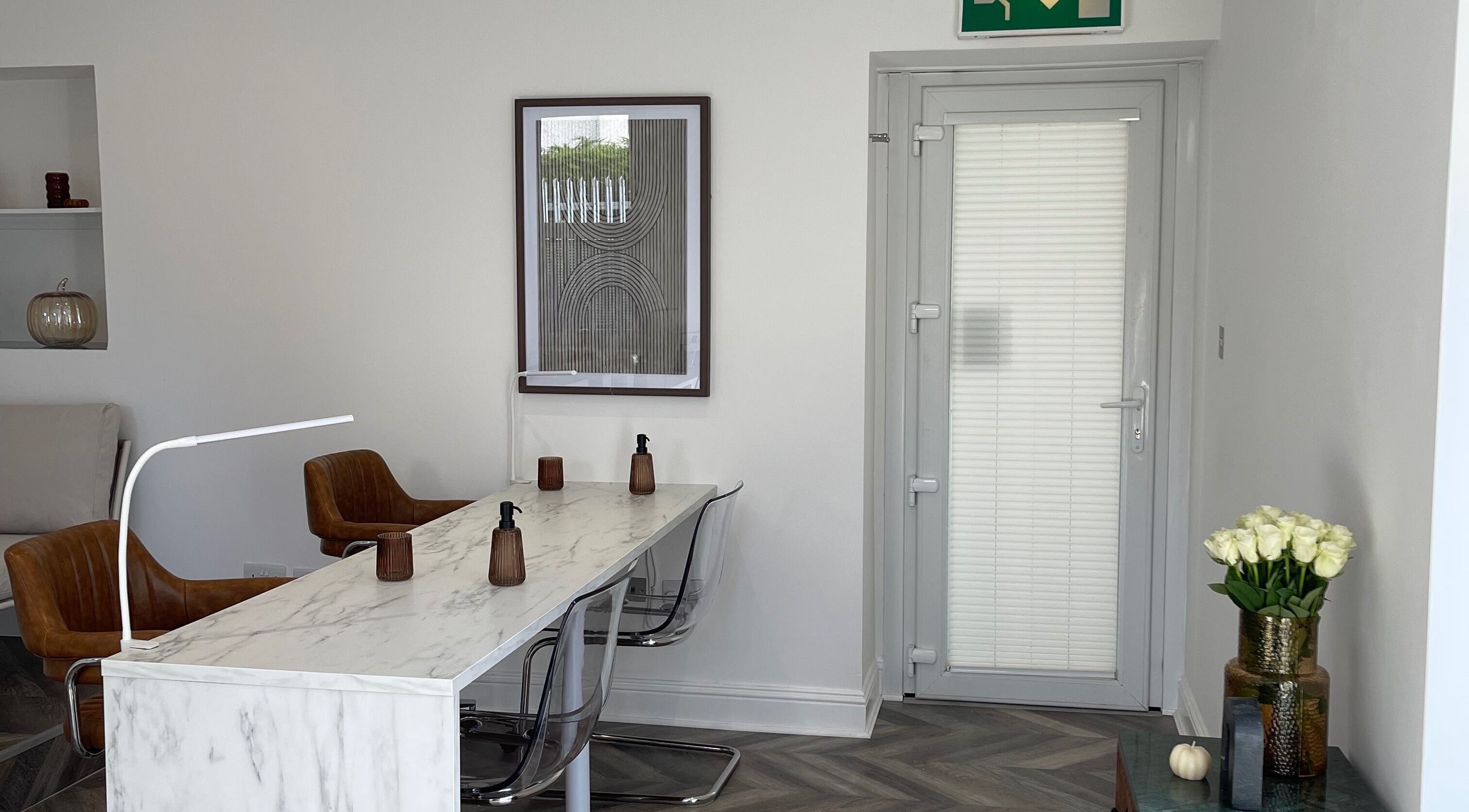 Chic interior of Spice and Paint Salon in Bathgate, Scotland, GB, featuring stylish seating and decor.