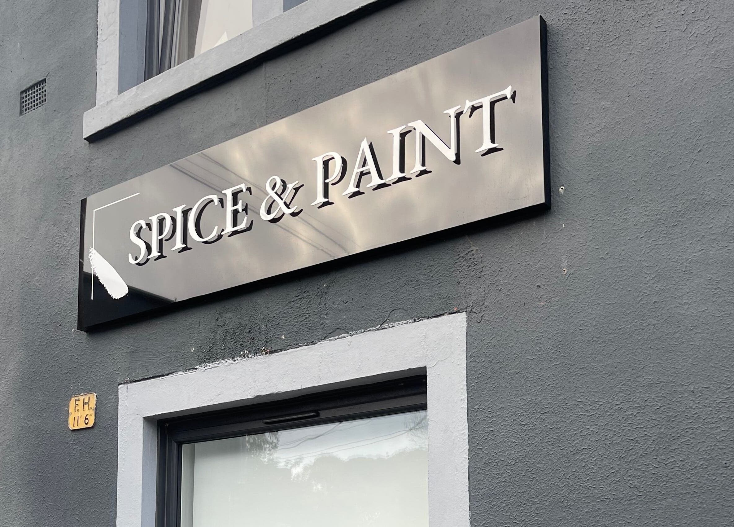 Elegant exterior sign of Spice and Paint Salon in Bathgate, Scotland.