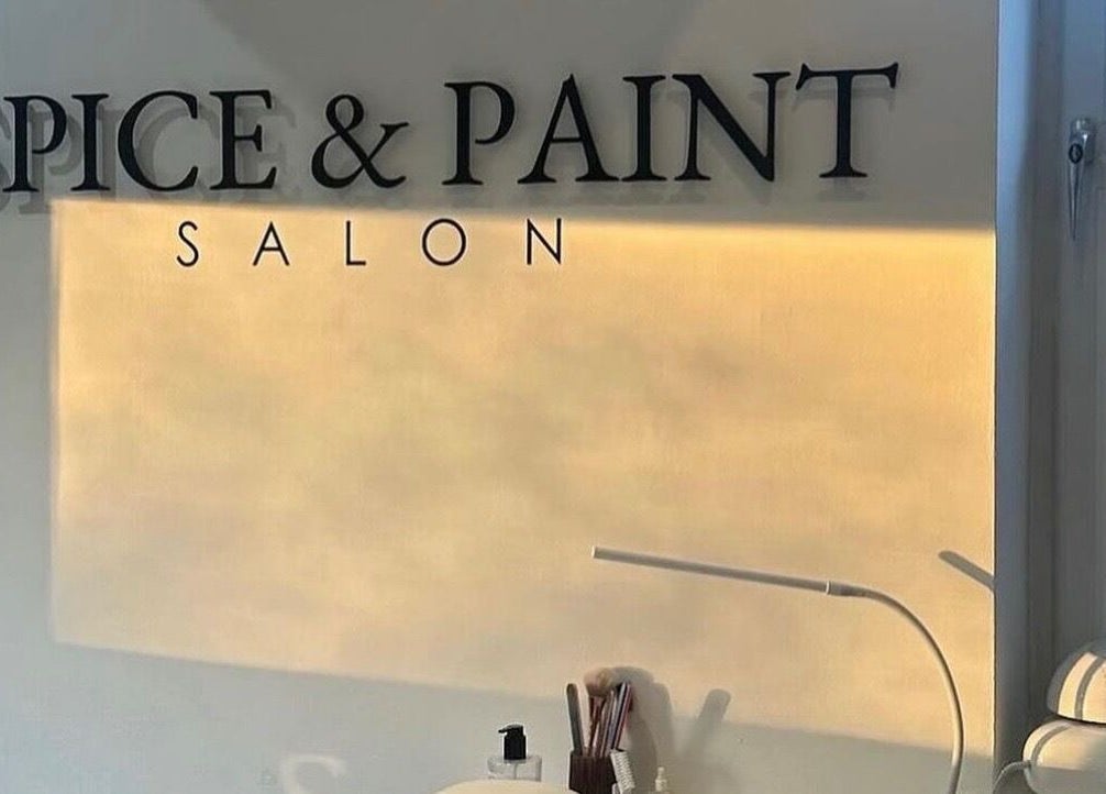 Interior view of Spice and Paint Salon in Bathgate, Scotland, GB with soft sunlight enhancing the calm ambiance.