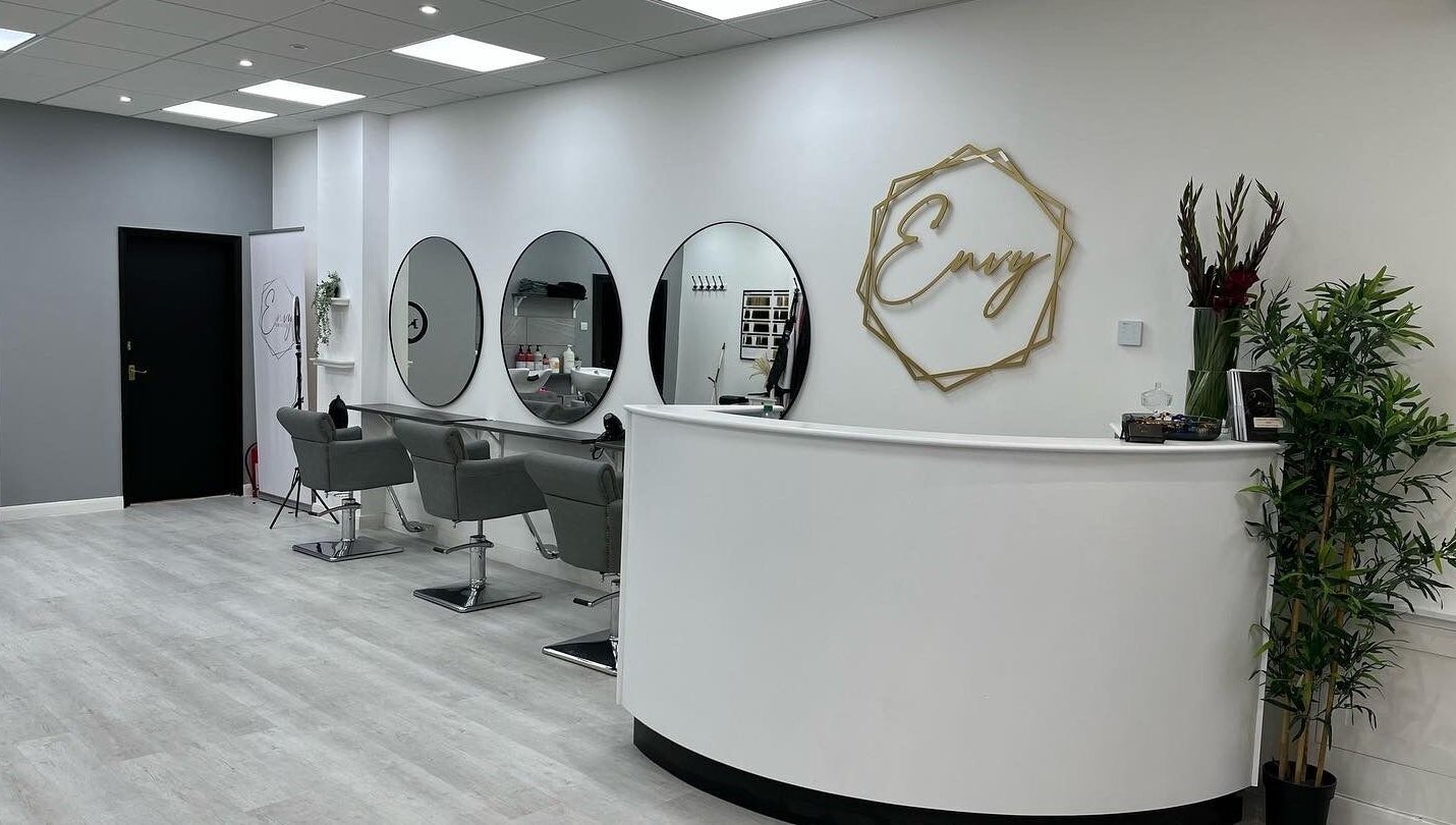 Modern interior of Envy Hair & Extensions in Eastbourne, England, GB featuring sleek styling stations and chic decor.