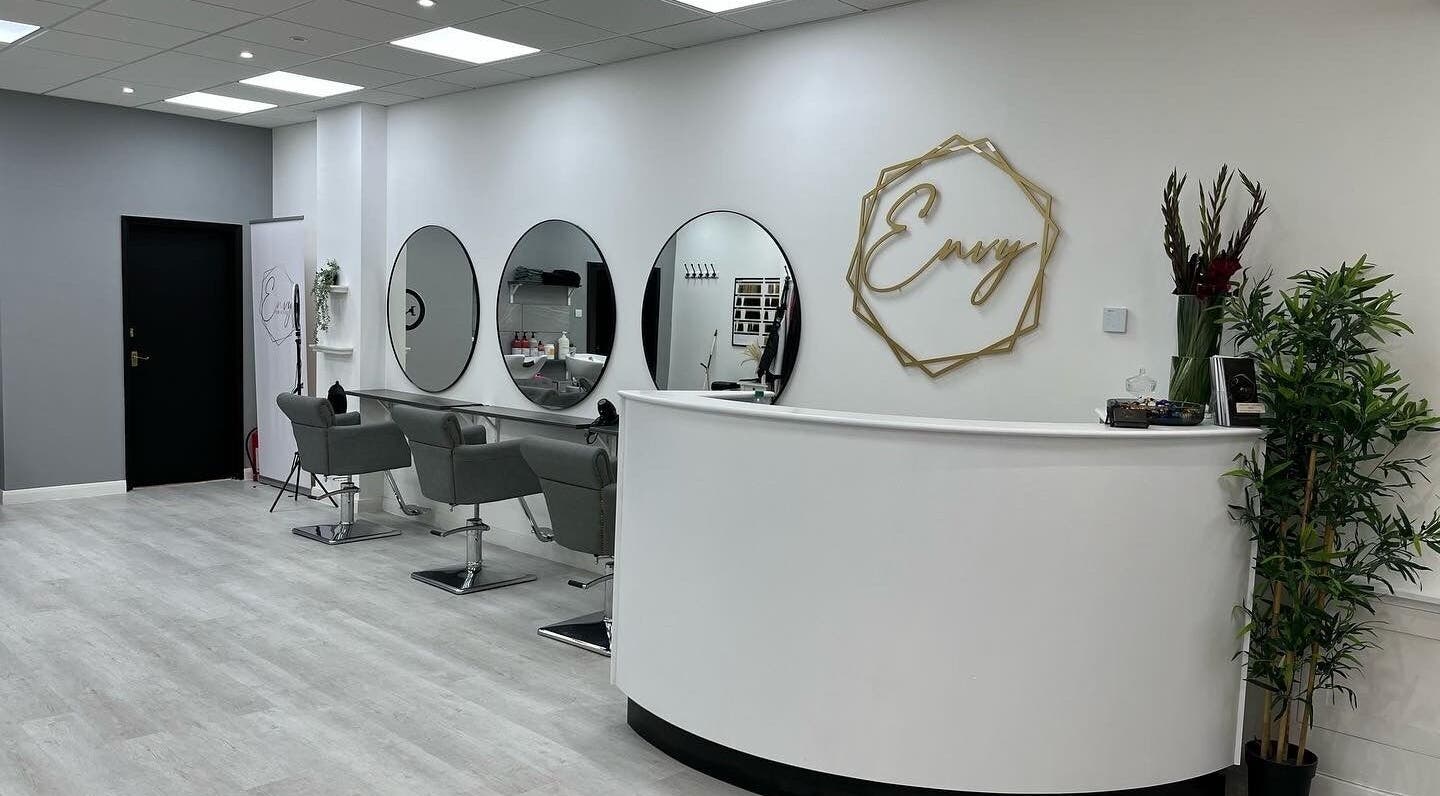 Modern interior of Envy Hair & Extensions in Eastbourne, England, GB featuring sleek styling stations and chic decor.