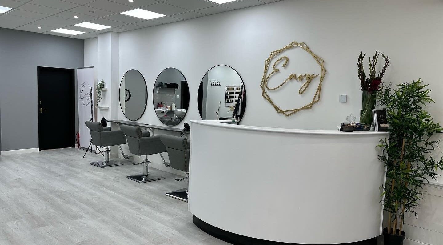 Modern interior of Envy Hair & Extensions in Eastbourne, England, GB featuring sleek styling stations and chic decor.