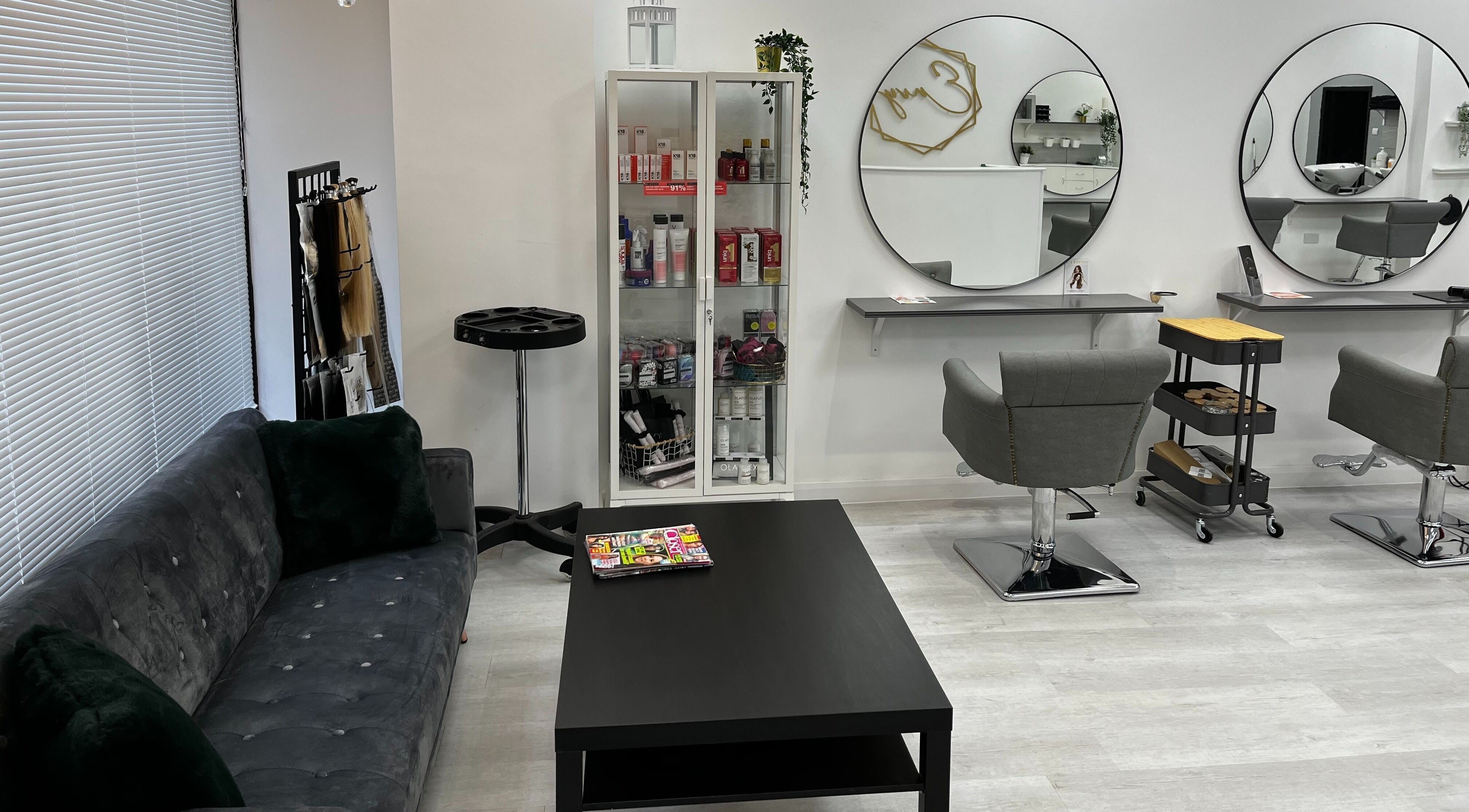 Sleek seating and styling area at Envy Hair & Extensions, Eastbourne, England, GB, showcasing modern elegance.