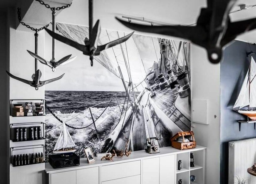 Nautical-themed decor at Old Sailor Barbershop, Oslo, Oslo, NO showcasing sails and anchors.