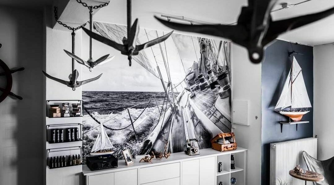 Nautical-themed decor at Old Sailor Barbershop, Oslo, Oslo, NO showcasing sails and anchors.