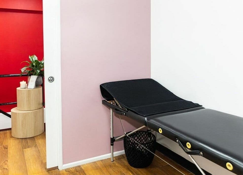 Serene massage room at Cosimo Hair Studio | Broadbeach, featuring a black massage table in Broadbeach, Queensland, AU.