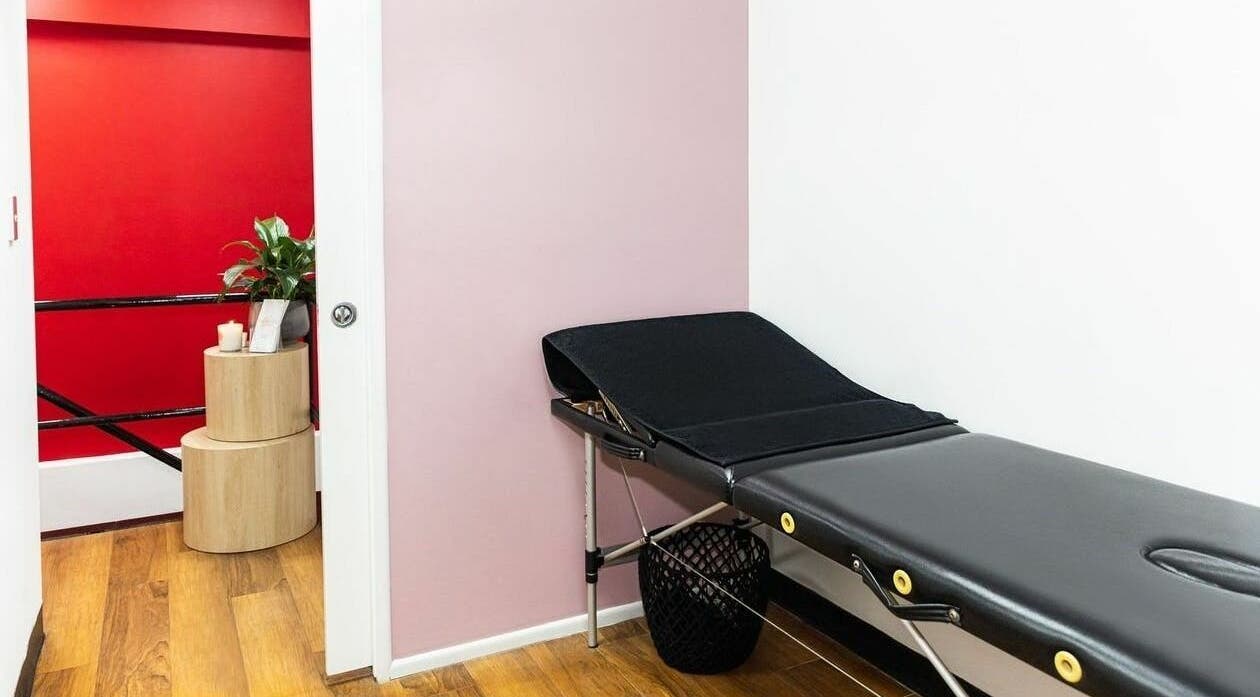 Serene massage room at Cosimo Hair Studio | Broadbeach, featuring a black massage table in Broadbeach, Queensland, AU.