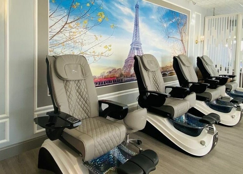 Luxurious pedicure chairs at Bonjour Nail Bar in Rancho Cucamonga, California, with a serene Paris backdrop.