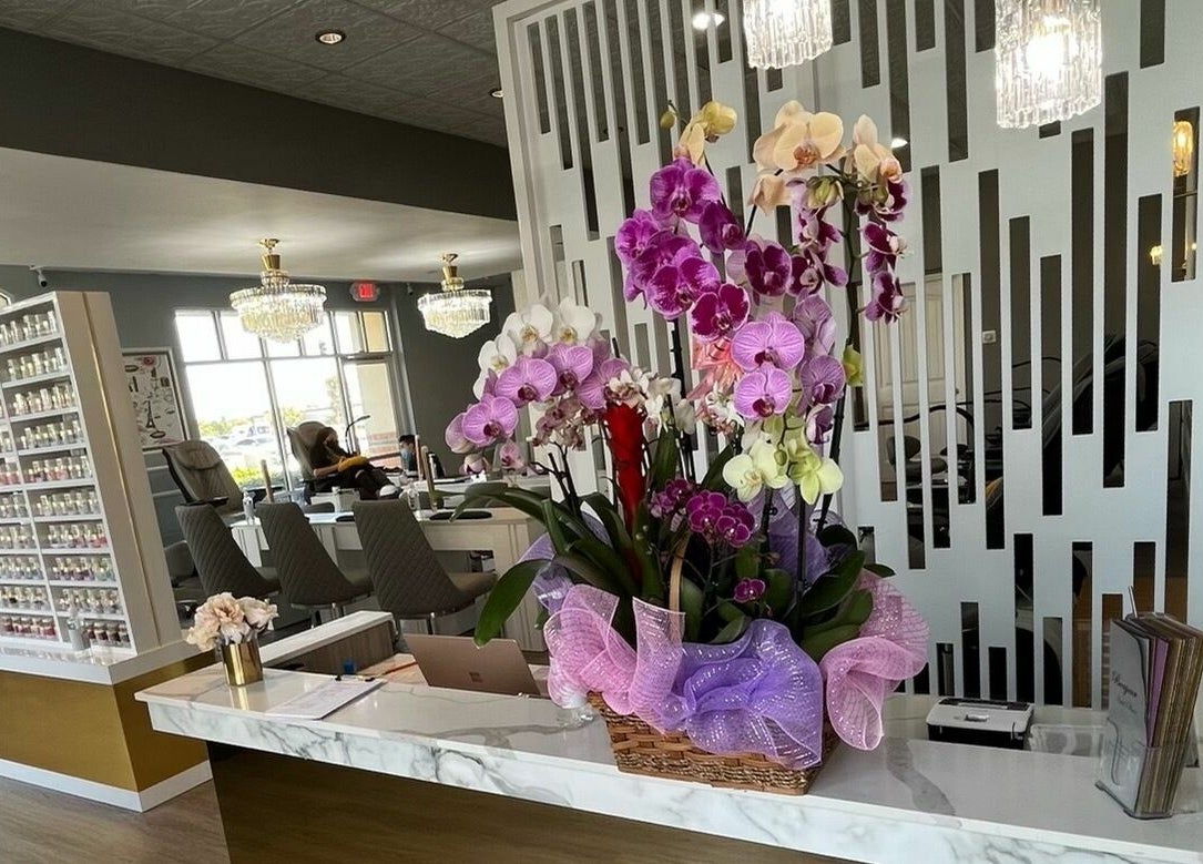 Bonjour Nail Bar's chic interior with stunning orchid display in Rancho Cucamonga, California, US.