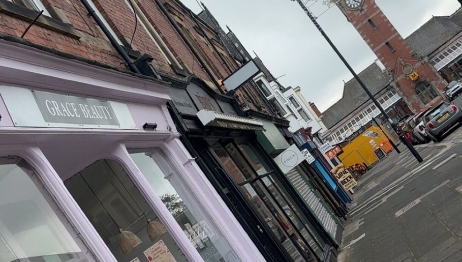 Charming street view near The Lash Clinic Vicky, Whitley Bay, England, GB showcasing local shops.
