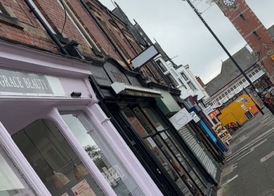 Charming street view near The Lash Clinic Vicky, Whitley Bay, England, GB showcasing local shops.