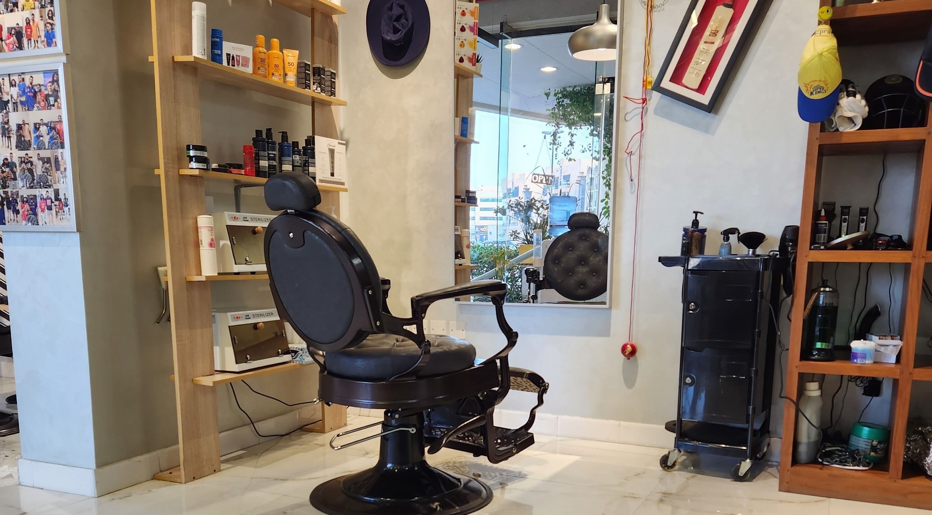 Chic interior of Blade & Beard Men Salon, Dubai, AE, showcasing barber chair and grooming products.