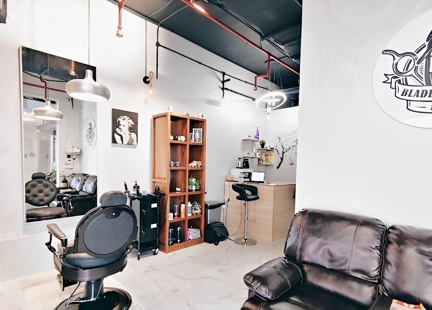 Interior of Blade & Beard Men Salon, Dubai, AE, featuring modern decor and barber chairs.