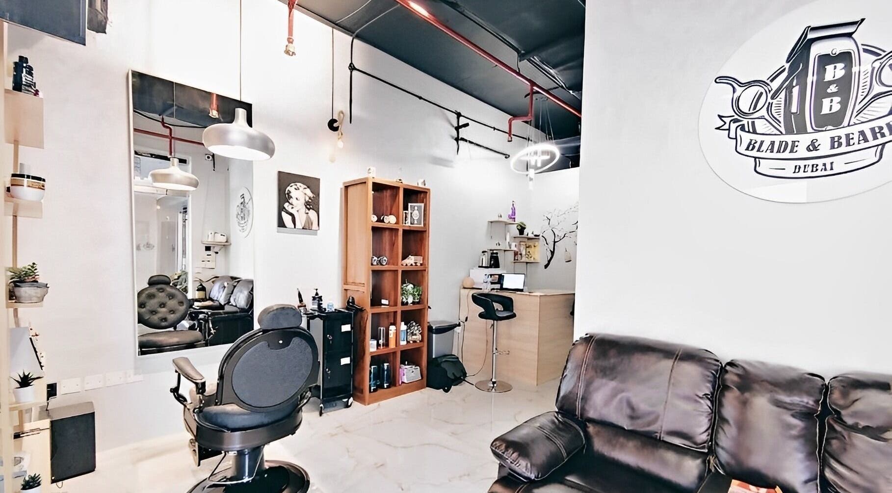 Interior of Blade & Beard Men Salon, Dubai, AE, featuring modern decor and barber chairs.