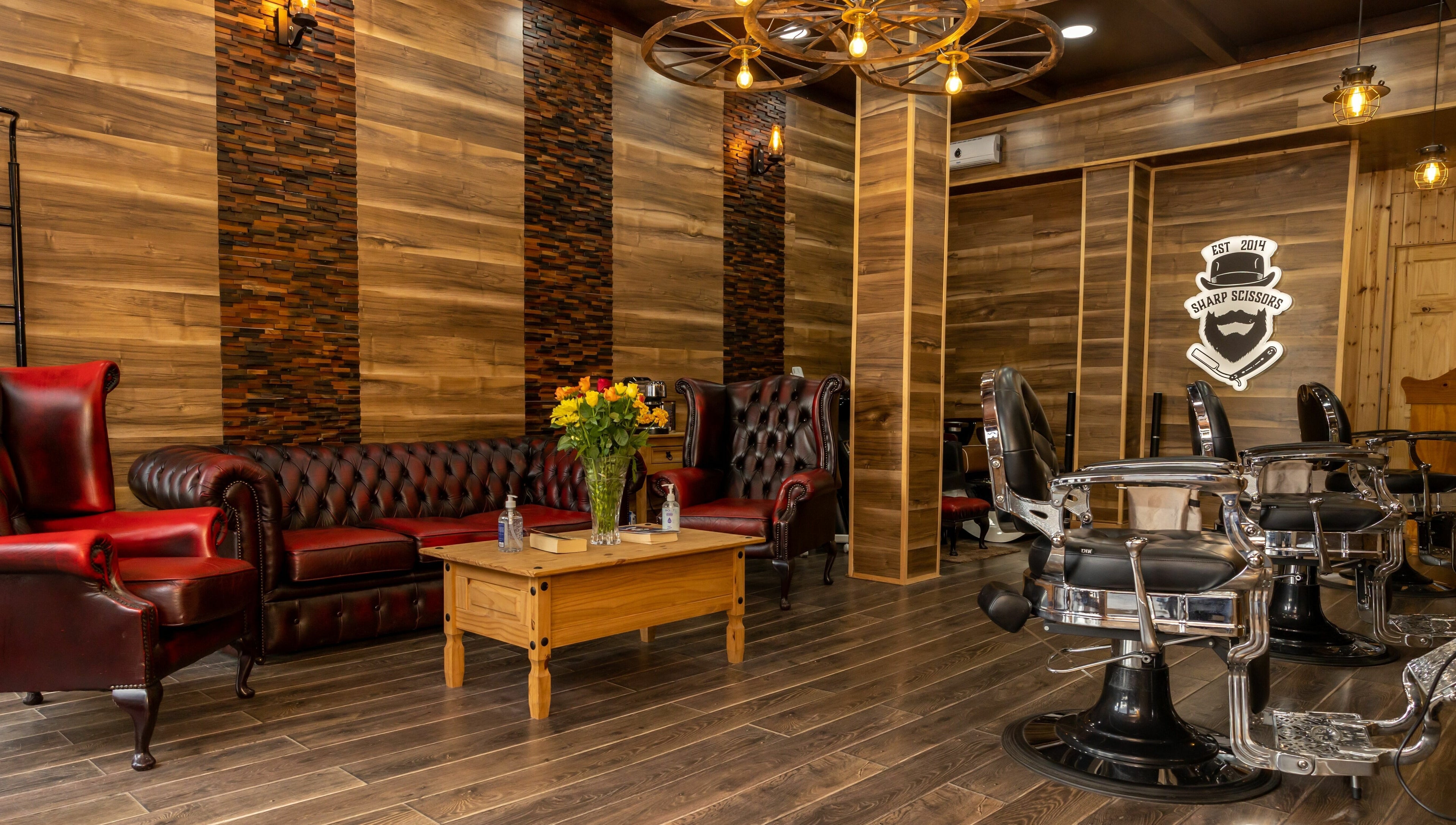 Elegant interior of Sharp Scissors in Glasgow, Scotland, GB with leather chairs and wood decor.