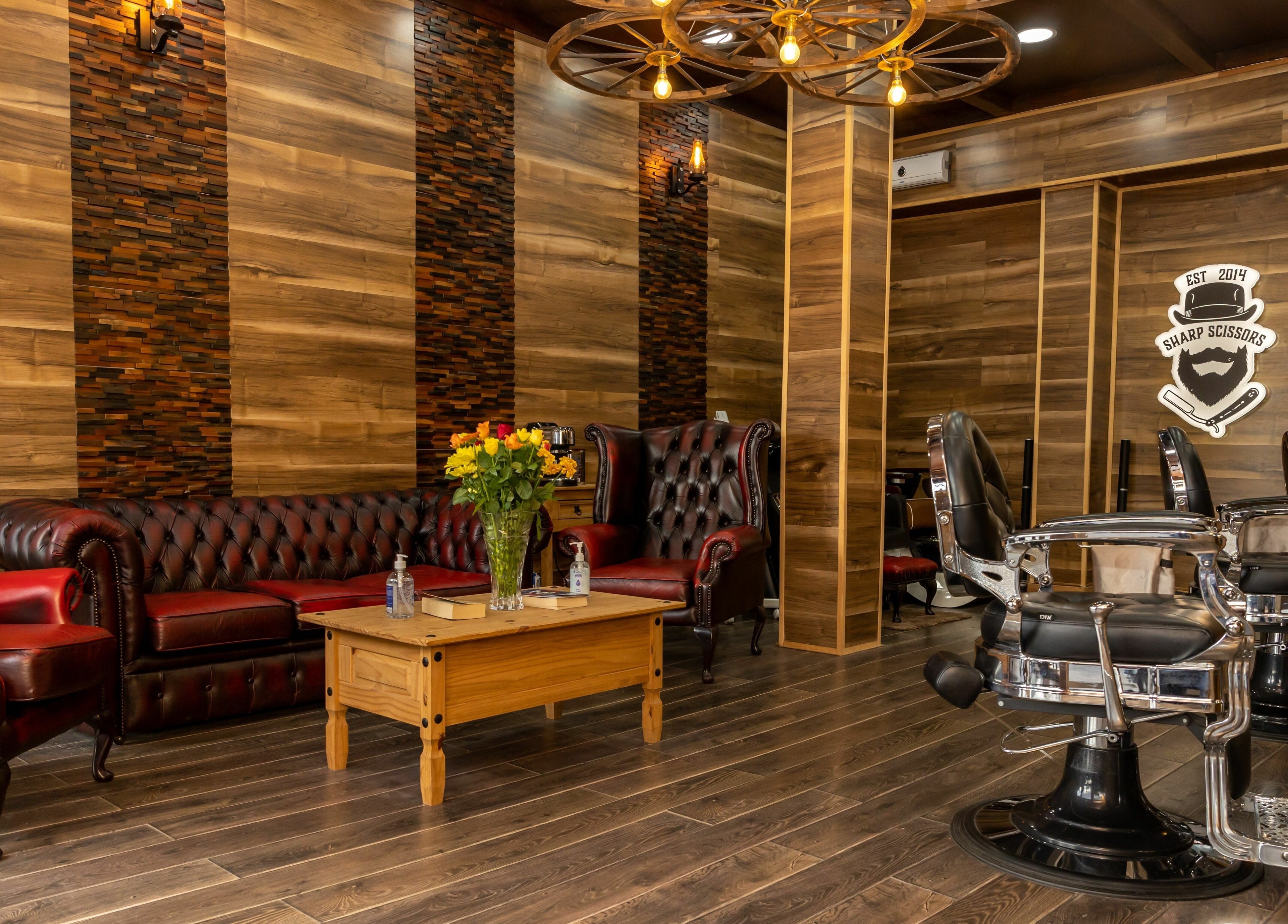 Elegant interior of Sharp Scissors in Glasgow, Scotland, GB with leather chairs and wood decor.
