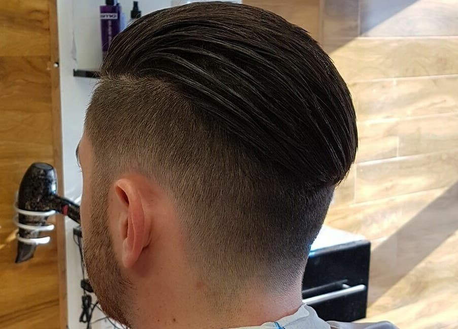 Sharp Scissors showcases a sleek men's hairstyle in their Glasgow, Scotland, GB salon.
