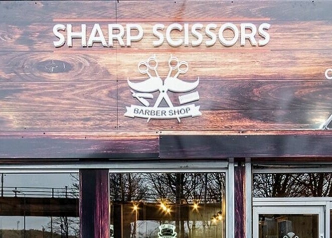 Exterior signage of Sharp Scissors at Glasgow, Scotland, GB.