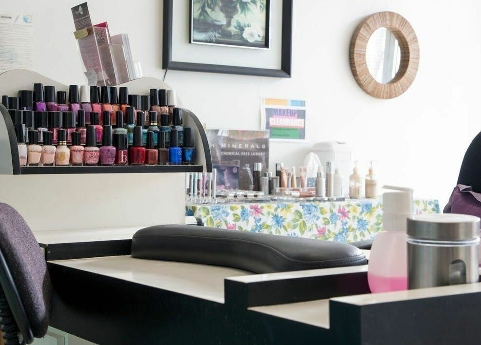 Nail polish display at Just Wax It, Seaton, South Australia, AU showcasing diverse color options.