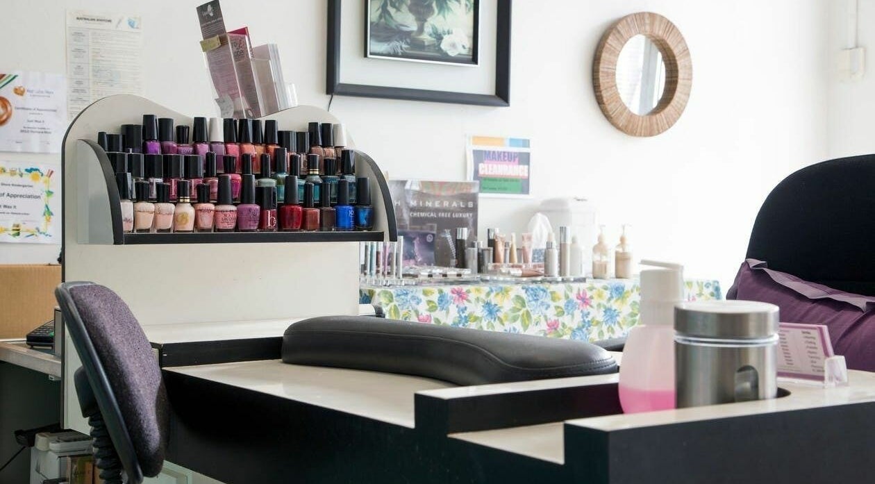 Nail polish display at Just Wax It, Seaton, South Australia, AU showcasing diverse color options.
