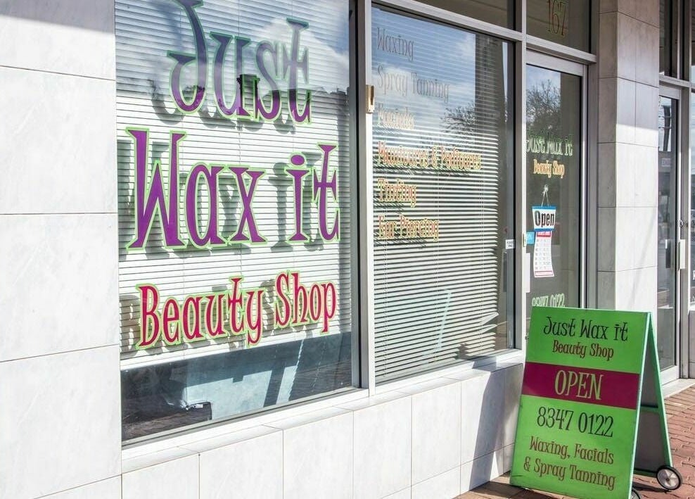 Just Wax It beauty shopfront in Seaton, South Australia offering waxing, facials, and spray tanning services.