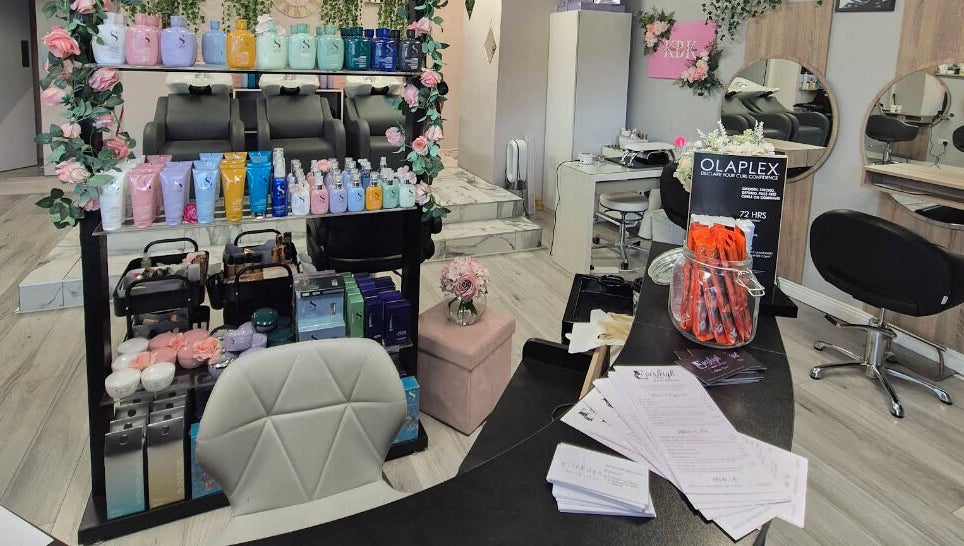 Everleigh Hair Design salon interior in Dublin, County Dublin, IE, showcasing stylish chairs and premium hair products.