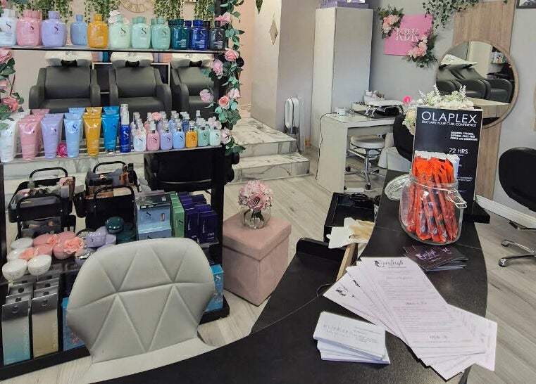 Everleigh Hair Design salon interior in Dublin, County Dublin, IE, showcasing stylish chairs and premium hair products.