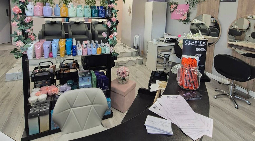 Everleigh Hair Design salon interior in Dublin, County Dublin, IE, showcasing stylish chairs and premium hair products.