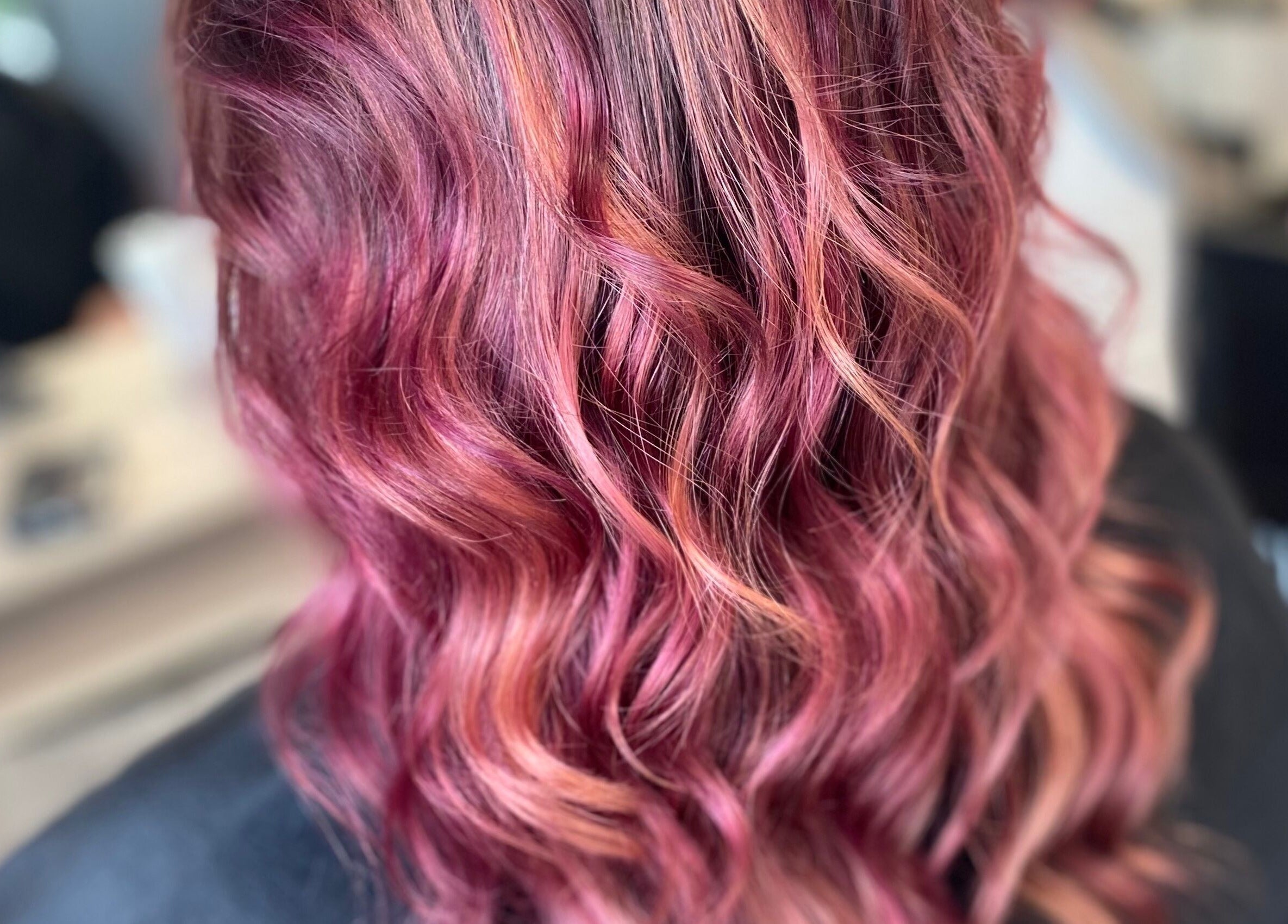 Ruby red wavy hairstyle at Everleigh Hair Design, Dublin, County Dublin, IE.