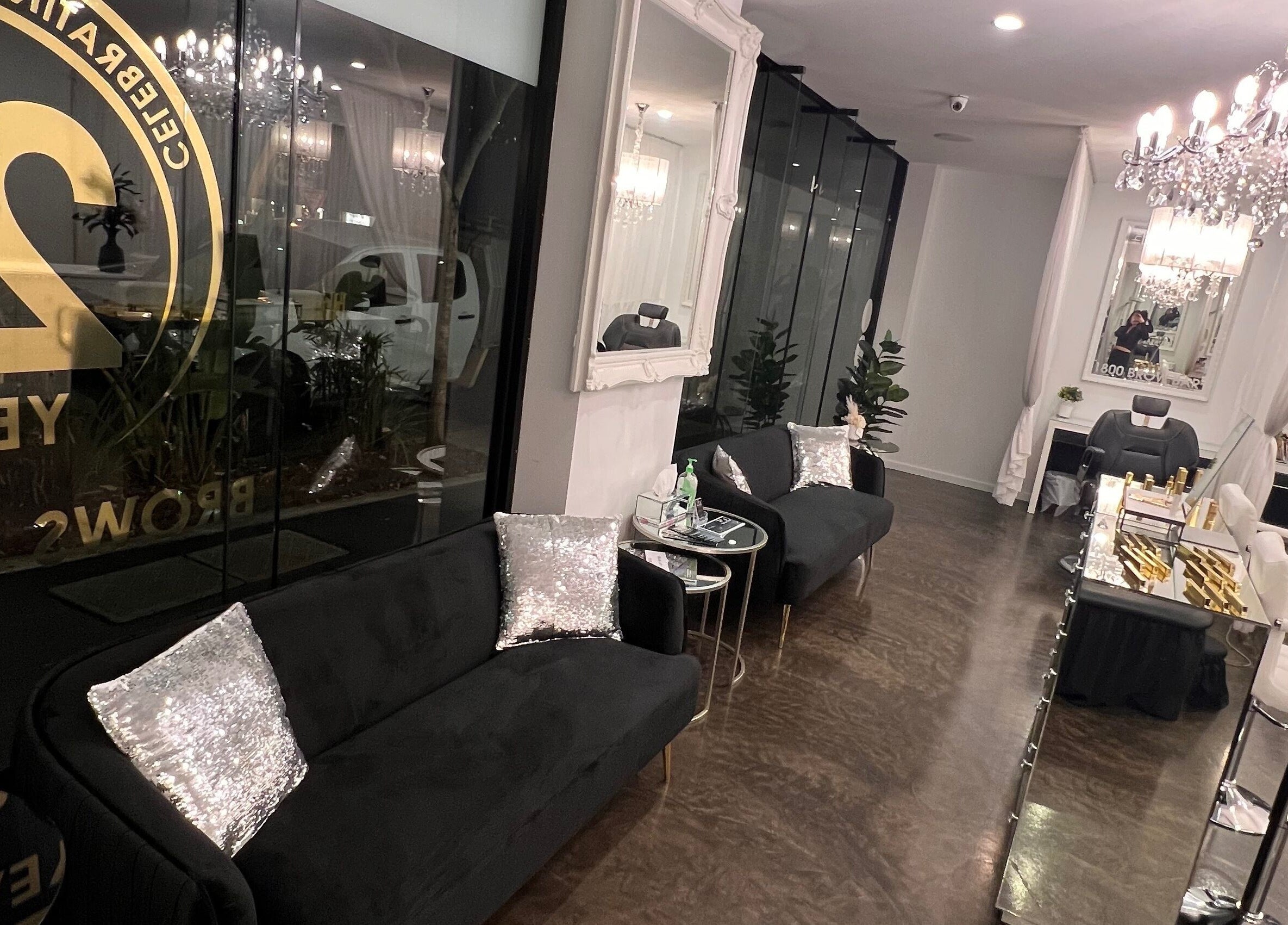 The Brow Bar Newstead, Queensland, AU offers a chic interior with plush seating and glamorous lighting.