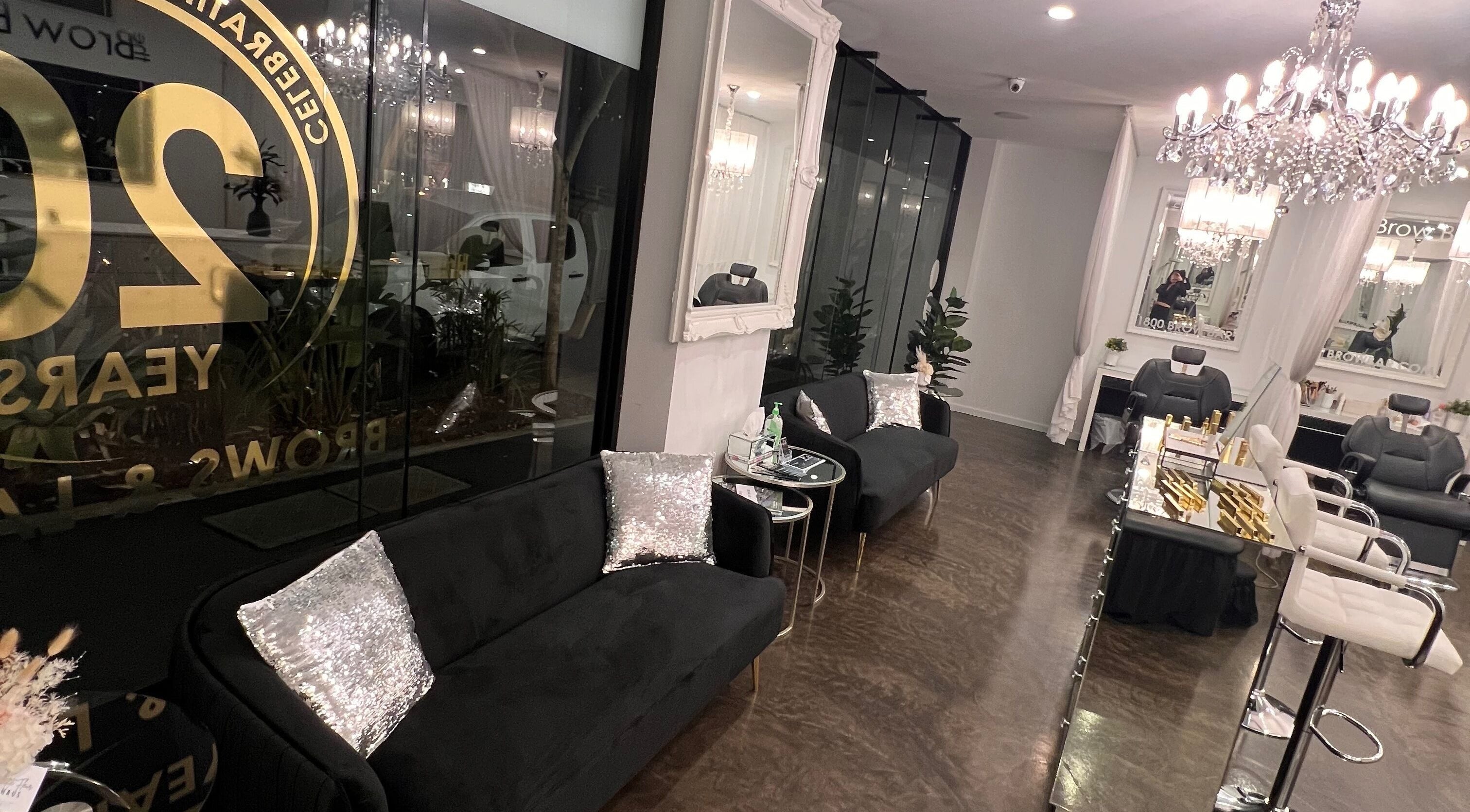 The Brow Bar Newstead, Queensland, AU offers a chic interior with plush seating and glamorous lighting.