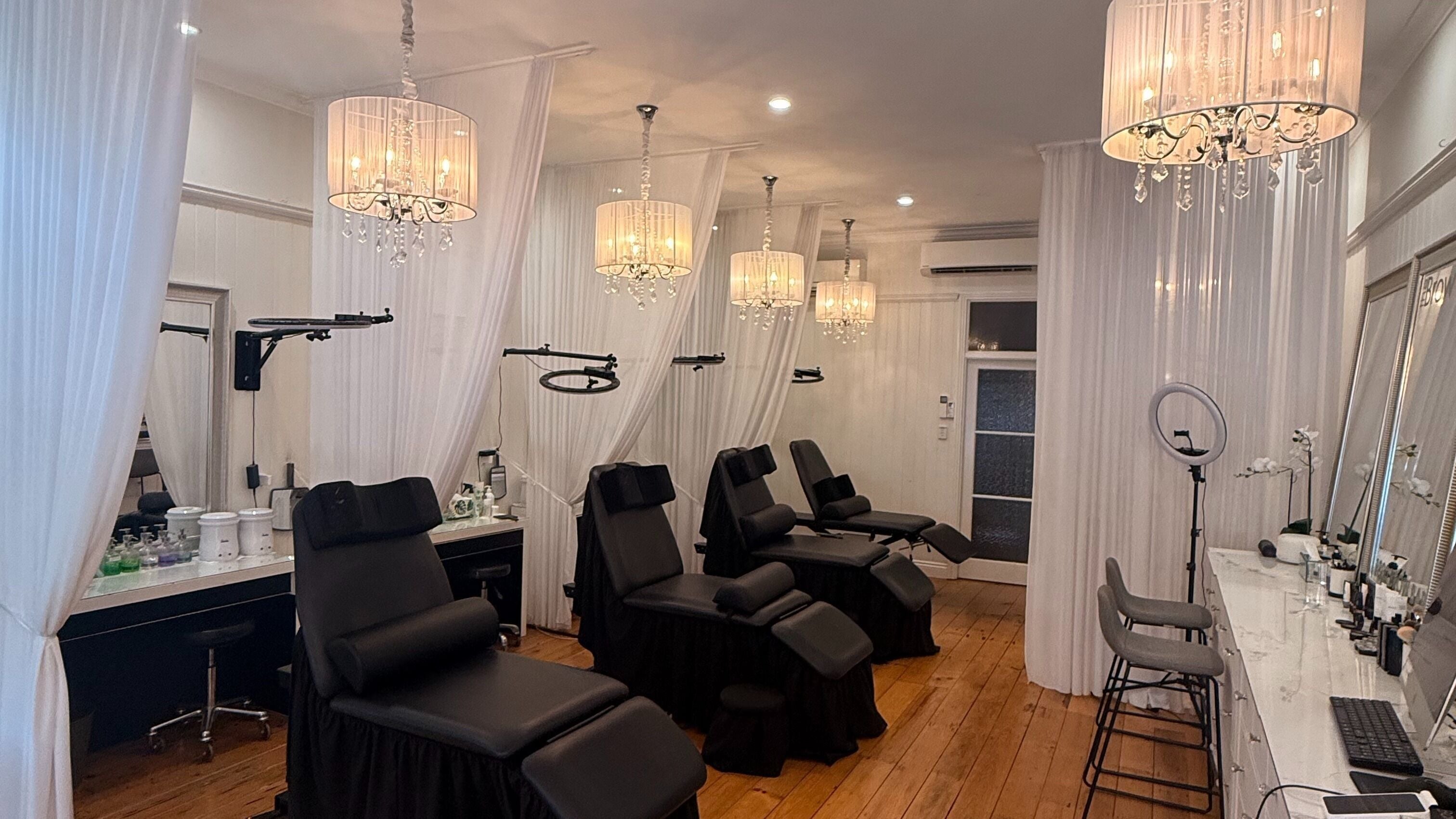 Luxurious beauty chairs and chandeliers at The Brow Bar Coorparoo, Queensland, AU.