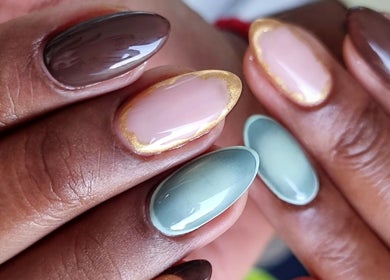 Stylish nail design at Nails by Chanelle, Westville, KwaZulu-Natal, ZA, featuring multicolored glossy finishes.