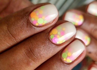 Colorful nail art at Nails by Chanelle in Westville, KwaZulu-Natal, ZA. Bright dots on manicured nails.