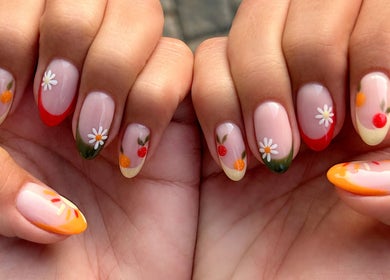 Stylish floral nail art at Nel White Nails, Umhlanga, Kwazulu-natal, ZA, showcasing vibrant colors and designs.