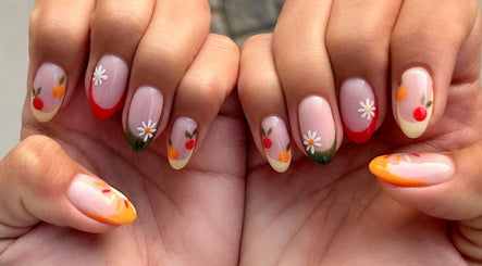 Stylish floral nail art at Nel White Nails, Umhlanga, Kwazulu-natal, ZA, showcasing vibrant colors and designs.