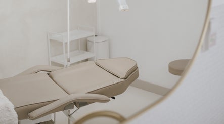Modern treatment room at Beauty Lane Tamworth, New South Wales, AU, featuring a comfortable beige spa bed.