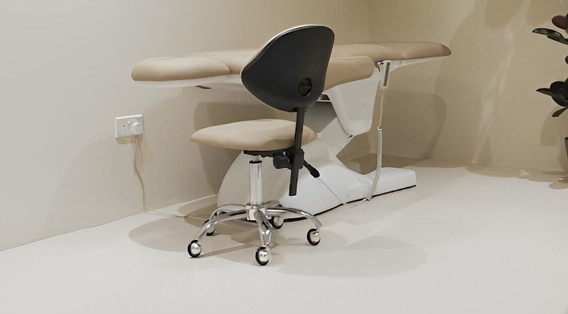 Modern treatment chair and stool at nnstudio, Singapore, Singapore, SG, offering a calming ambiance.