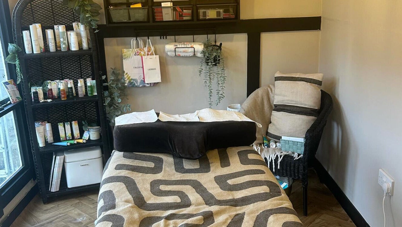 Relaxing treatment room at Dollface Beauty by Beth, Lostock Hall, England, GB, featuring a cozy massage bed.