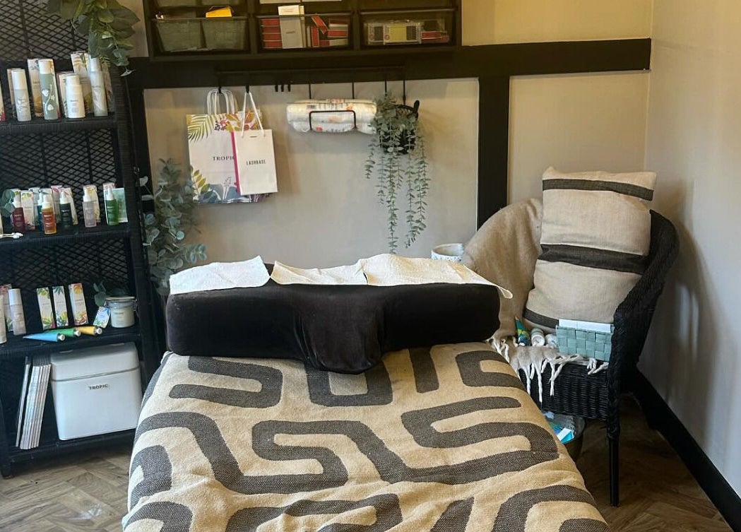 Relaxing treatment room at Dollface Beauty by Beth, Lostock Hall, England, GB, featuring a cozy massage bed.