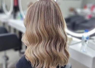 Elegant wavy hairstyle at Mike and Kals salon in Dubai, AE.