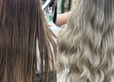 Stunning hair transformation at Mike and Kals, Dubai, AE showcasing sleek brown to blonde waves.