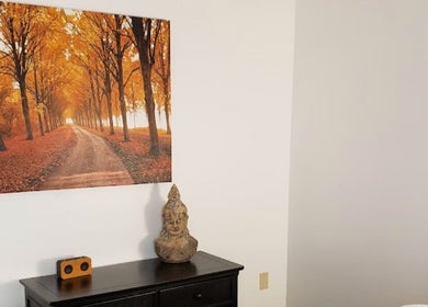 Warm autumn scene and sculpture at Clinical Elements in Loveland, Ohio US, creating a tranquil ambiance.